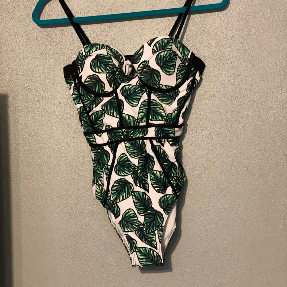 Women’s size medium leaf print one piece swimsuit